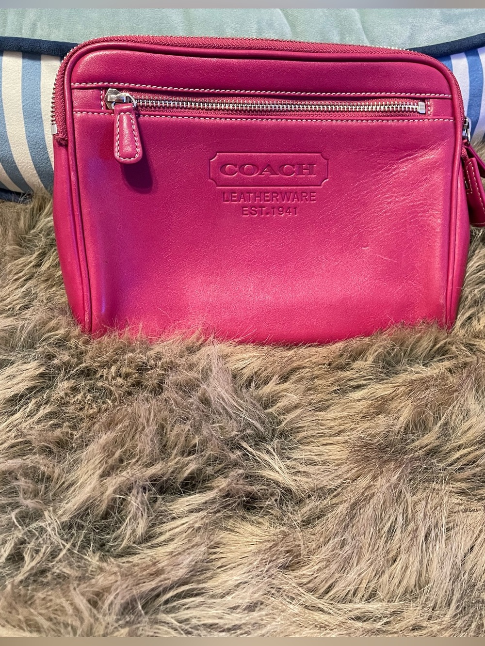 Fuchsia pink Coach clutch bag